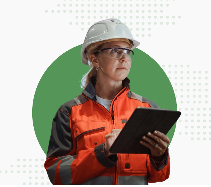 Factory worker in hard hat with clipboard.